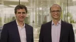 Fernando Fernandez, Unilever’s Chief Executive Officer, standing on the left and Srinivas Phatak, Unilever’s acting Chief Financial Officer, standing on the right. Both are wearing dark suits with light coloured shirts.